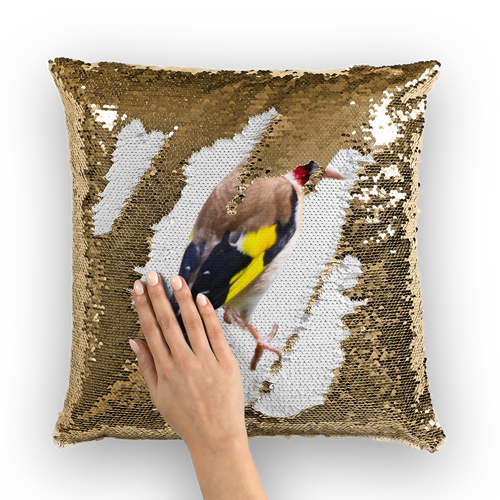 Gold sequinned cushion that has a hidden large print goldfinch bird when swiped