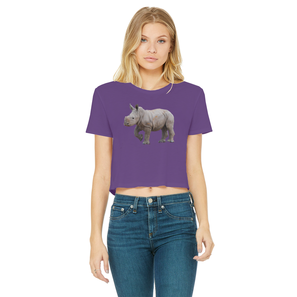 a girl wearing a purple crop top with a rhino. T-shirt has a round neck.