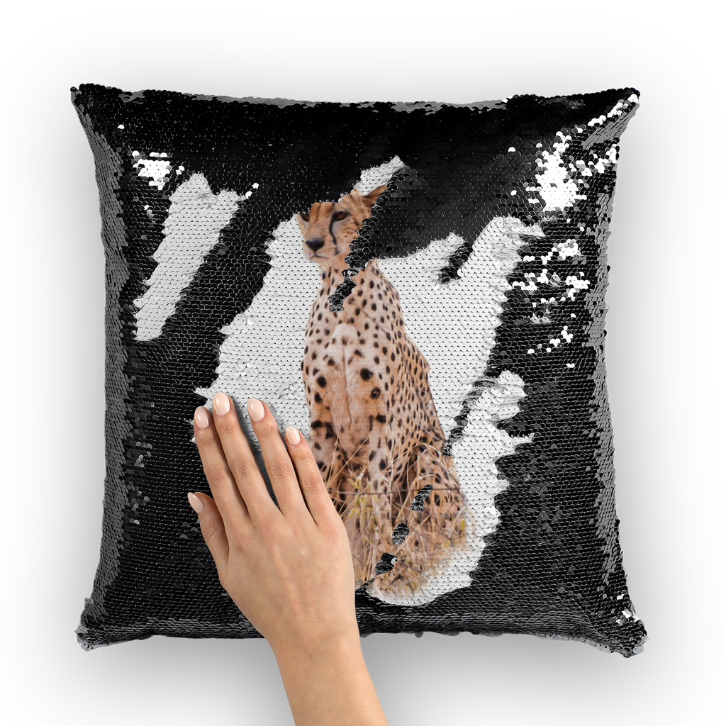 Black sequinned cushion that has a hidden large print cheetah when swiped