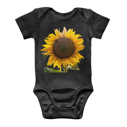 black baby onesie with a large sunflower print
