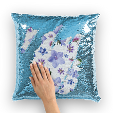 Load image into Gallery viewer, Blue sequinned cushion that has a hidden blue and purple floral print with a white background
