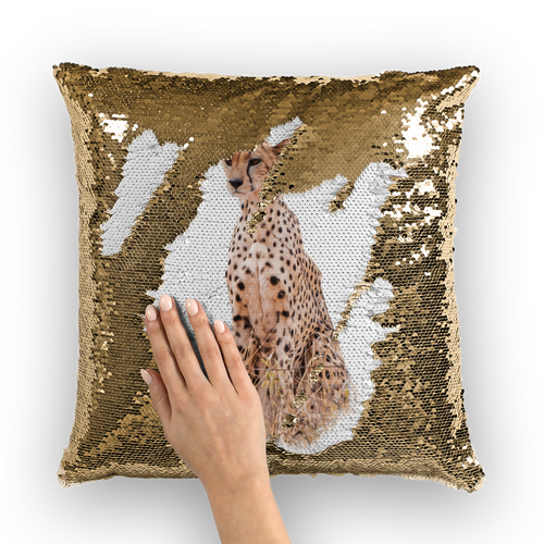 Gold sequinned cushion that has a hidden large print cheetah when swiped