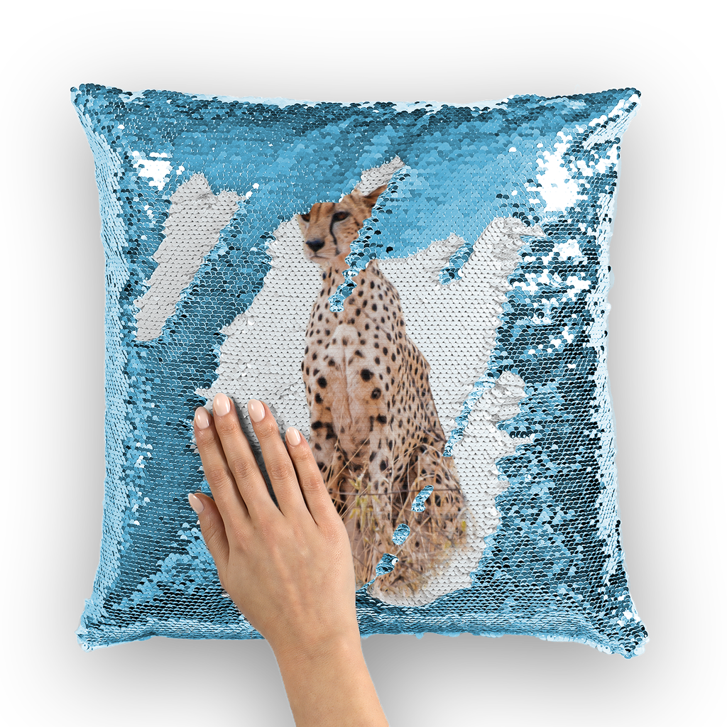 Blue sequinned cushion that has a hidden large print cheetah when swiped