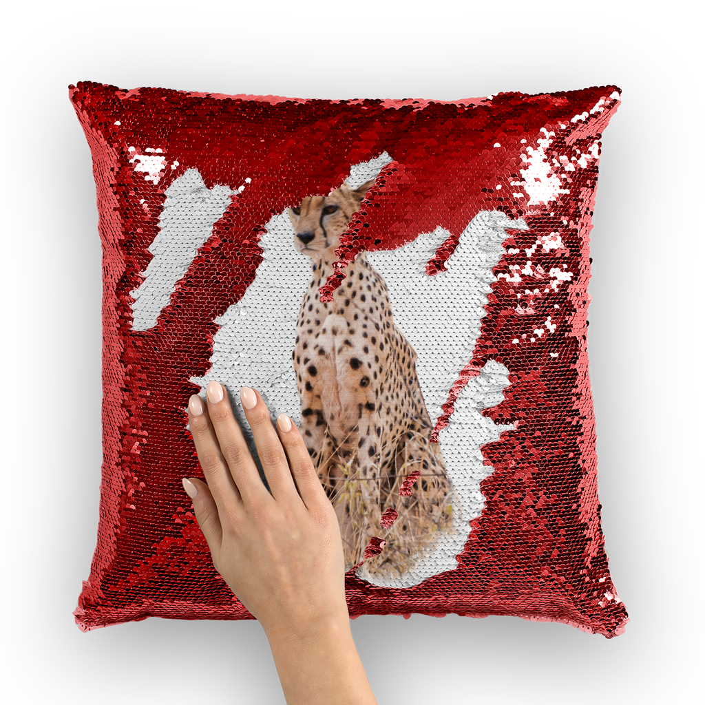 Red sequinned cushion that has a hidden large print cheetah when swiped