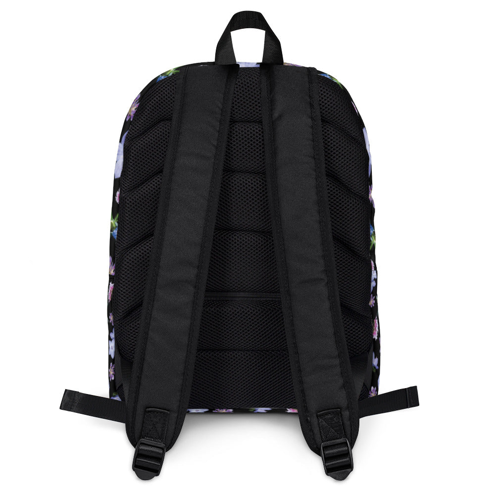 Black floral backpack in a water resistant material from the back