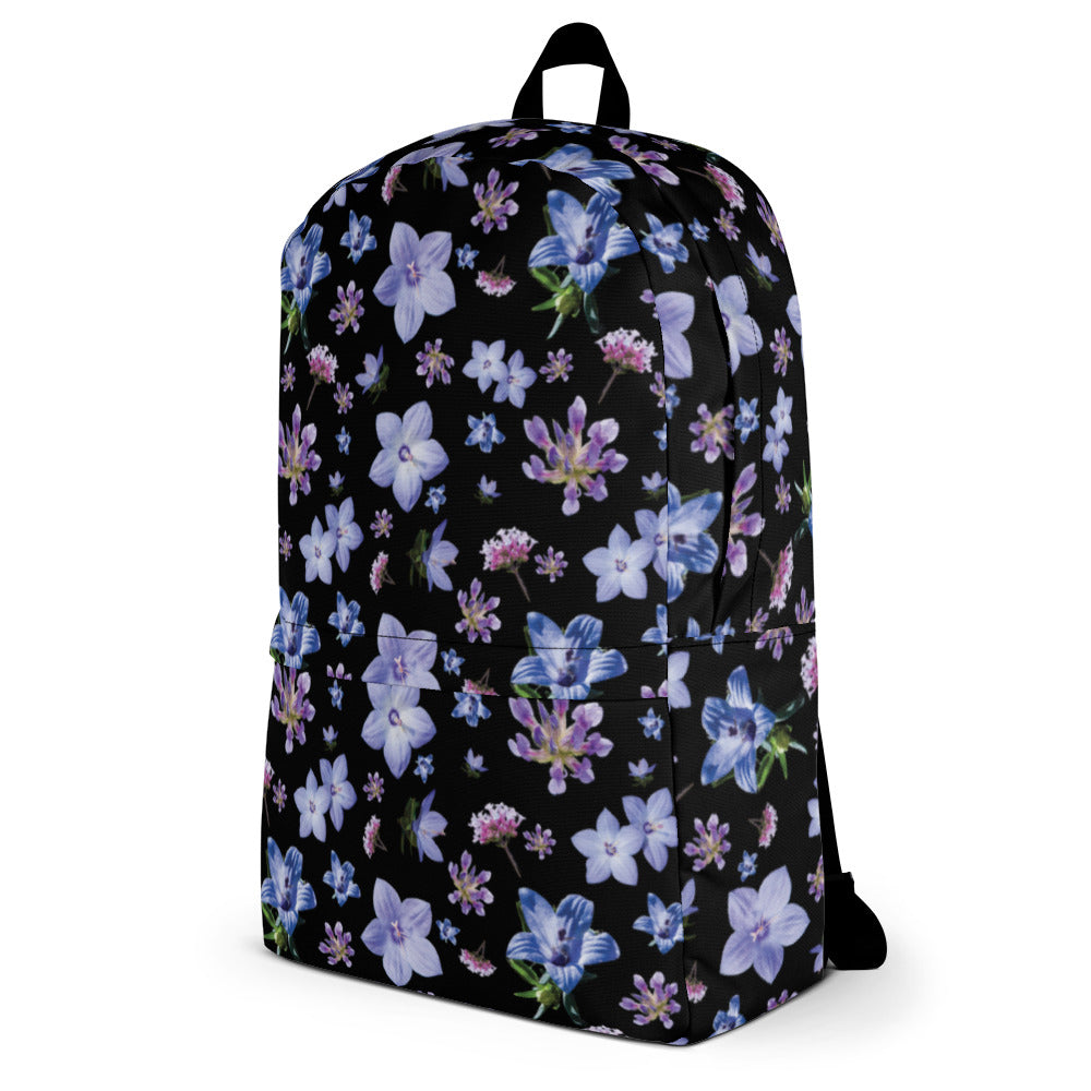 Black floral backpack in a water resistant material from the right side.