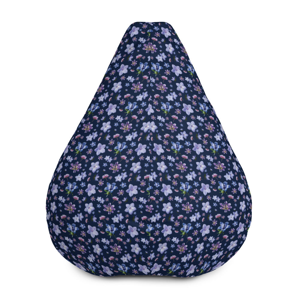 Front view of a dark navy bean bag chair with a blue and purple floral repeating pattern