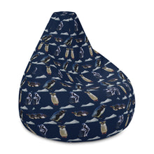 Load image into Gallery viewer, Side of dark navy bean bag chair with repeating pattern of penguins and icebergs
