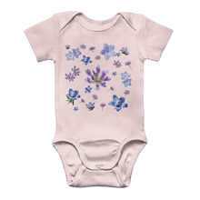 Load image into Gallery viewer, Light pink onesie for babies with a blue and purple floral pattern on front
