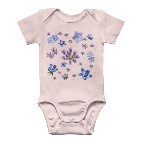 Light pink onesie for babies with a blue and purple floral pattern on front