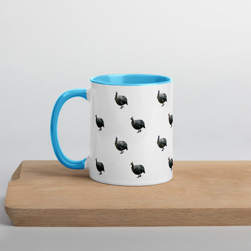White guinea fowl coffee mug with a blue handle and inside